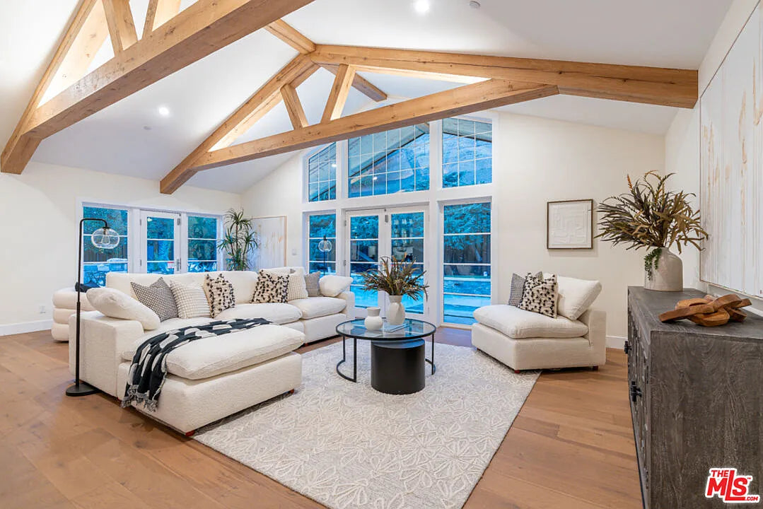 Custom large wood box beam truss used for adding depth for a large living room. 